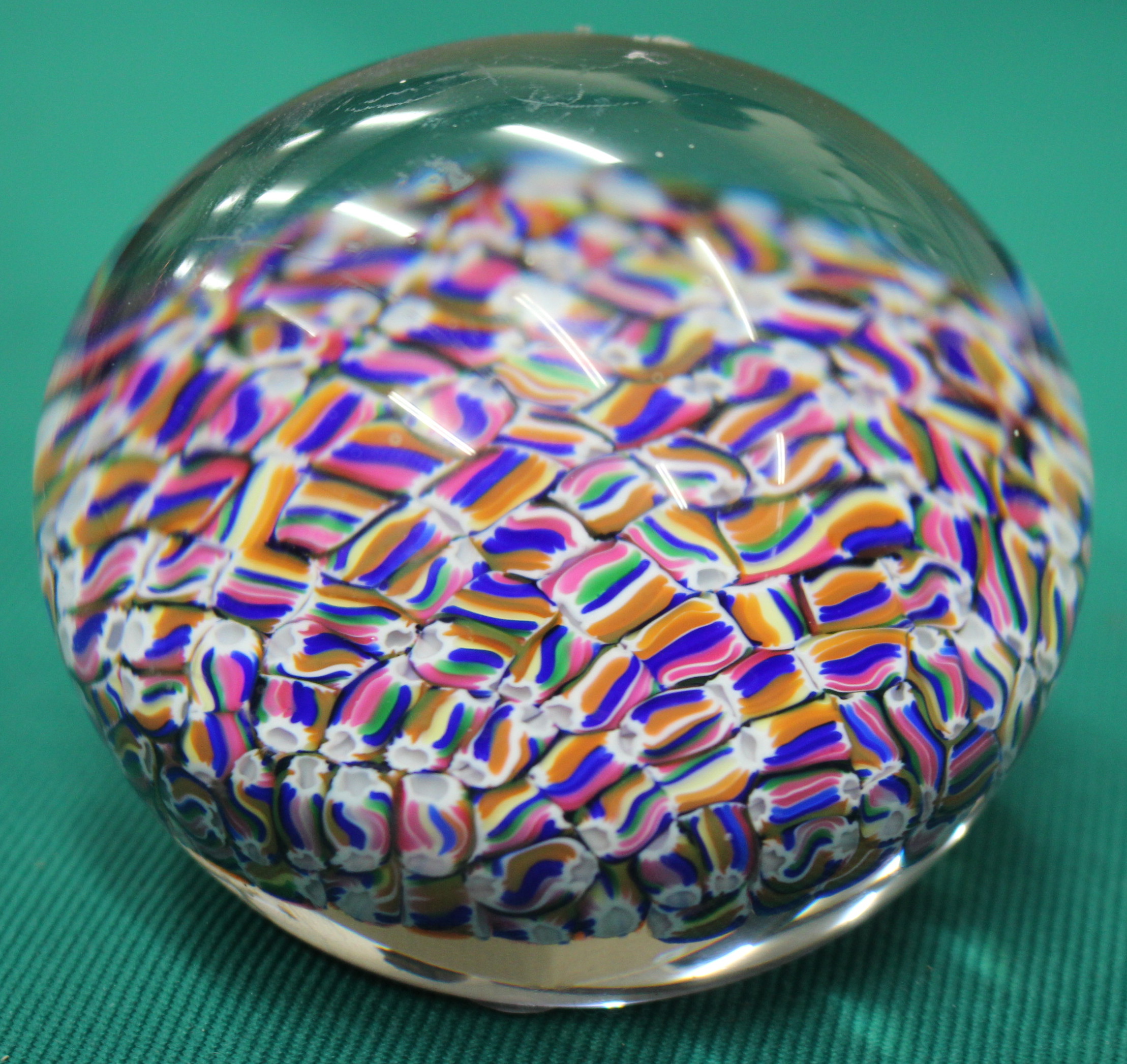 A MODERN BACCART DOMED TOPPED PAPERWEIGHT with etched mark beneath and decorated with interlaced