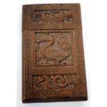 AN OLD INDIAN CARVED HARDWOOD CALLING CARD CASE decorated with birds and fish, 5cm wide