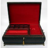 A MODERN LEATHER MOUNTED JEWELLERY BOX with brass paw feet, carrying handles to the side and