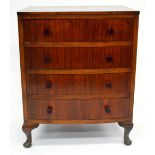 A SMALL WALNUT BOW FRONTED CHEST OF FOUR LONG DRAWERS with turned composite handles and on short