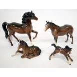 A BESWICK PORCELAIN BROWN COLOURED HORSE, 70.5cm high together with a further similarly coloured