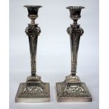 A PAIR OF ELKINGTON & CO. SILVER PLATED CANDLESTICKS each with gadrooned drip pans and square