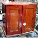 A VICTORIAN POLISHED OAK CUTLERY CABINET the tiered fitted drawers enclosed by panelled doors 58cm