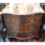 AN 18TH CENTURY STYLE WALNUT VANEERED SMALL SERPENTINE CHEST of two short and two long drawers