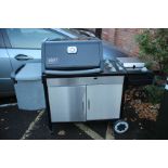 A WEBBER GENESIS BARBECUE with cover and instructions