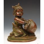 A PERSIAN STYLE BRONZE FIGURE OF A KNEELING GIRL with ewer on a stylised oval base, 19cm high