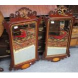 A PAIR OF GEORGIAN STYLE FRET FRAMED WALL MIRRORS each with Hoho bird crests and shell inlay (