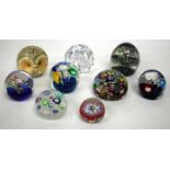 A PERTHSHIRE PAPERWEIGHT with a scrambled ground filled with coloured canes, two with animals and