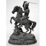 AN EARLY 20TH CENTURY SPELTER SCULPTURE of a knight upon horseback, wielding a sword, 48cm tall