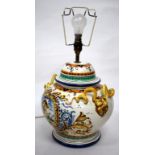 A MAJOLICA TIN GLAZED POTTERY LAMP BASE in the renaissance style with mask handles and pleated