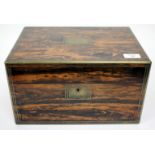 A VICTORIAN ROSEWOOD AND BRASS BOUND DRESSING BOX the lifting lid opening to reveal a fitted