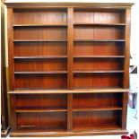 A LARGE GEORGIAN STYLE DARK STAINED LIBRARY BOOKCASE with fluted pilaster columns and adjustable