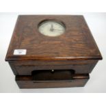 AN EARLY 20TH CENTURY OAK TABLE TOP CLOCKING IN AND OUT TIME RECORDER by The Gledhill-Brook Time