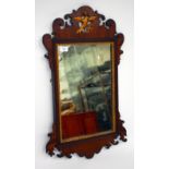 A GEORGIAN STYLE MAHOGANY FRET FRAMED WALL MIRROR with Hoho bird crest, 45cm wide x 73cm high