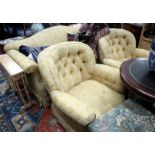 A THREE SEATER SETTEE with shaped back and rolled arms on square tapering legs and brass castors,