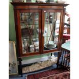 A MAHOGANY DISPLAY CABINET, the interior fitted with two glass shelves enclosed by astragal doors on