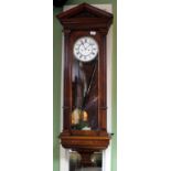 A WALNUT CASED VIENNA REGULATOR the case with architectural pediment and glazed sides and door