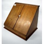 AN OLD OAK STATIONARY BOX with fall front and fitted interior, 39cm wide