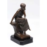 A CONTEMPORARY BRONZE SCULPTURE OF A GIRL SEATED IN A CONTEMPLATIVE POSE on a rock, the sculpture