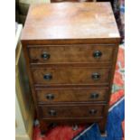 A WALNUT SMALL NARROW GEORGIAN STYLE CHEST OF FOUR DRAWERS standing on splaying bracket feet, 42cm