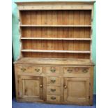 A VICTORIAN PINE DRESSER BASE with associated plate rack above, the plate rack with cup hooks and