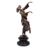 A CONTEMPORARY BRONZE SCULPTURE OF A DANCING GIRL, her hair in bunches and with flowers, the