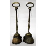 A PAIR OF EARLY 20TH CENTURY HORSES HOOF AND BRASS DOOR PORTERS both circa 1917, one inscribed '