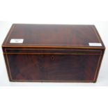 A GEORGE III MAHOGANY TEA CADDY with boxwood stringing, lion mask ring handles to the side and