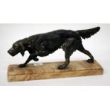 AN OLD SPELTER SCULPTURE of a pointer dog, mounted on a stepped marble base, the base 41cm long