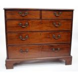 A GEORGE III MAHOGANY STRAIGHT FRONT CHEST of two short and three long drawers, with brass handles