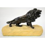 A BRONZE SCULPTURE OF A LION having a monogram stamped on the back leg and standing on a stone base,