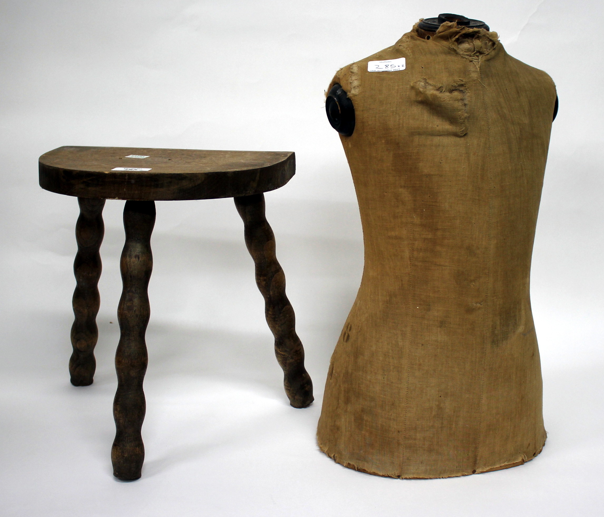 AN EARLY 20TH CENTURY MANNEQUIN 48cm in height together with a milking stool (2)