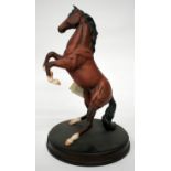 A ROYAL DOULTON PORCELAIN SCULPTURE OF A PRANCING HORSE "Spirit of the Wild", mounted on a