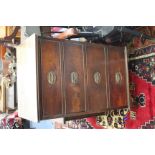 A NARROW MAHOGANY CHEST OF FOUR DRAWERS standing on bracket feet, 55cm wide x 93.5cm high