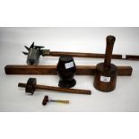 A TREEN STRING BARREL together with a turned wooden carvers mallet, a spirit level, a bradawl, a