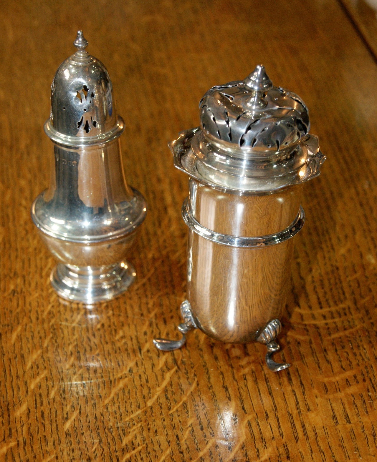 Silver caster of baluster form with urn shaped finial, London 1967, together with a silver caster of