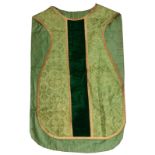 A GREEN VELVET AND NEEDLEWORK PRIEST'S VESTMENT, another and three further pieces of