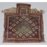 AN AFSHAR SOUMAC SALT BAG with diagonal star motif within a triple border in polychrome dyes with