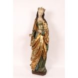 AN EARLY THREE QUARTER SIZE CARVED WOOD FIGURE of St Barbara with painted and gilded decoration,