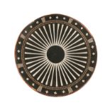 A LAOS CIRCULAR WOODEN SHIELD with lacquered radiating sunburst motif with attached straps and