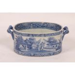 A 19TH CENTURY ENGLISH PORCELAIN BLUE AND WHITE TRANSFER PRINTED TWO HANDLED FOOT BATH with oriental