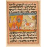 AN INDIAN MINIATURE painted with three stately figures and horse in a landscape within inked text to