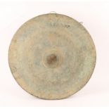 AN ANTIQUE TIMOR CIRCULAR METAL GONG with lobed centre, Indonesia, 64cm diameter