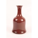 A CHINESE COPPER RED GLAZED MALLET SHAPED VASE with four character mark, 19th Century, 22.3cm high