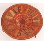 A FINE HARAR ETHIOPIAN CIRCA 1950 BASKET with radiating polychrome decoration, leather edge and