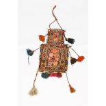 A SHAHSAVAN SALT BAG with polychrome star decoration and attached tassels, approximately 38 x 23cm