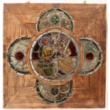 A FRENCH STAINED GLASS QUATREFOIL WINDOW, the central circular panel depicting Christ within an