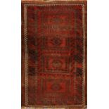 A BELOUCH WINE GROUND RUG with four central rectangular panels within a multiple border, 133 x 80cm