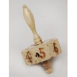 A 19TH CENTURY BONE POLYGONAL TEETOTUM with numerals and turned handle, 6.5cm