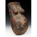 AN AFRICAN TRIBAL CARVED WOODEN PREGNANT FEMALE TORSO with stylised decoration, approximately 60cm